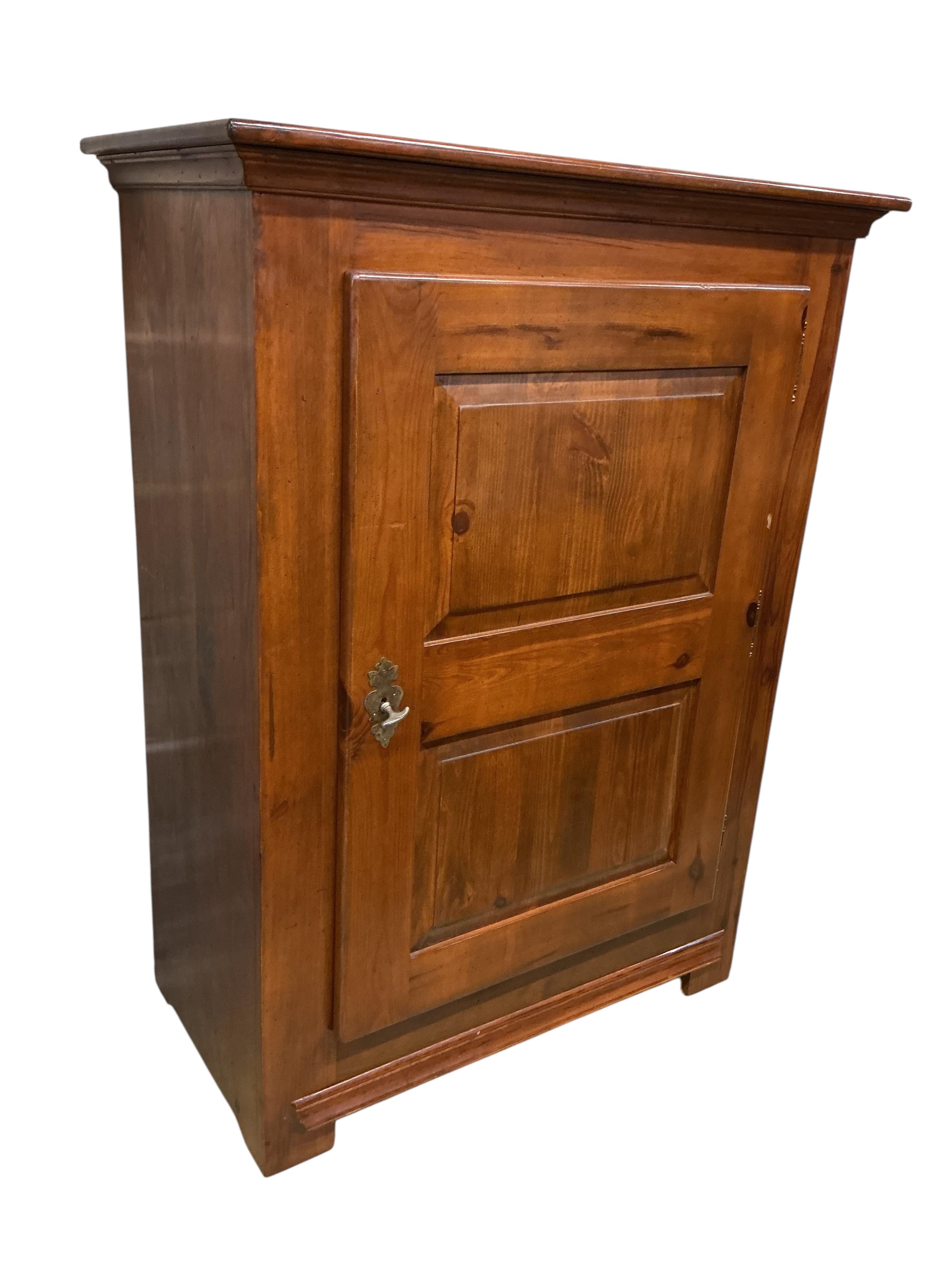 A reproduction 18th century style French pine side cabinet, width 104cm, depth 55cm, height 140cm